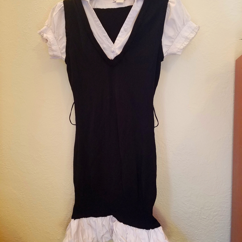 Black dress with white collar, sleeves, and hem